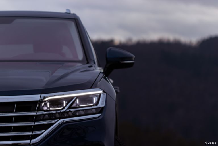 A black Volkswagen Atlas's driver side headlight.